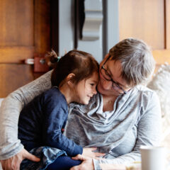 Grandmother at coffee shop with her sweet granddaughter