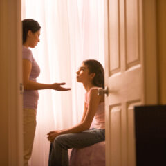 Hispanic mother talking to daughter